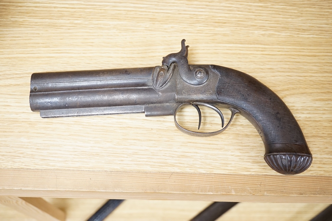 A double barrel over and under 16 bore percussion holster pistol by J. Beattie, barrels 14cm, London proofed, engraved; J. Beattie, Regent Street, London, with foliate engraved boxlock action and finely chequered walnut